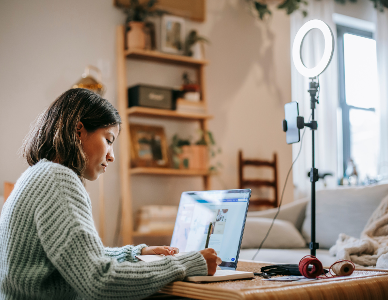 A focused woman starting her blogging journey on her laptop.