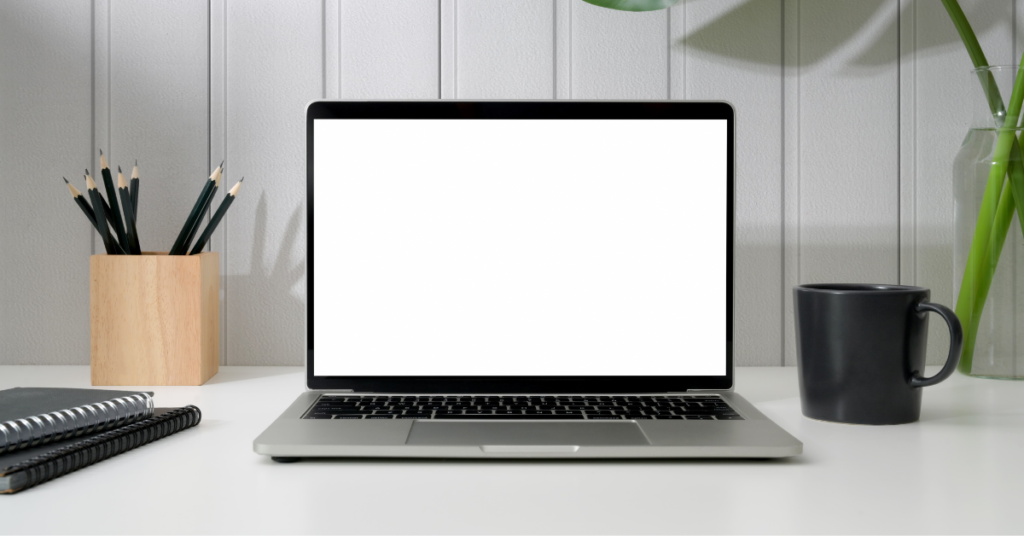 Efficient home office space displaying a laptop with space for personalized content.