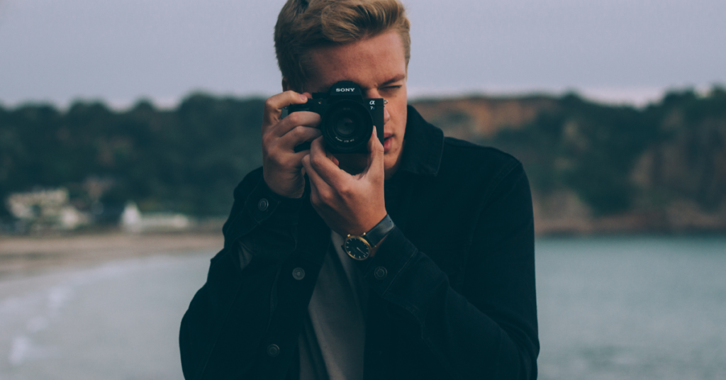 Photography enthusiast records beachside moments with a cutting-edge Sony camera.