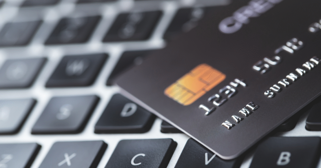 Credit card debt elimination process showing cut credit cards and budget planning documents