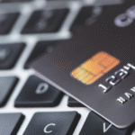 Credit card debt elimination process showing cut credit cards and budget planning documents